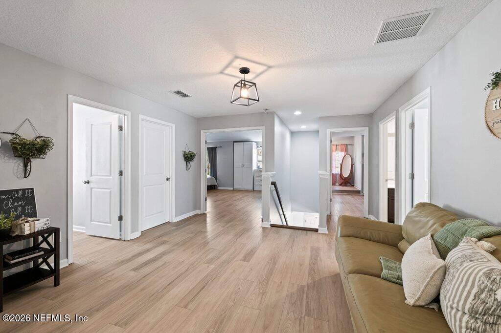 81015 Lockhaven Drive Yulee, FL 32097 - Photo 26 of 55 a view of a livingroom with furniture and wooden floor