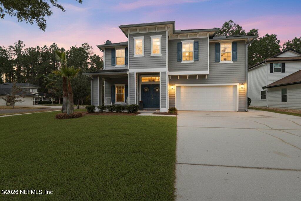 81015 Lockhaven Drive Yulee, FL 32097 - Photo 3 of 55 a front view of a house with a yard