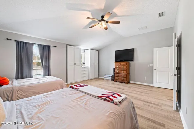 a bathroom with a double vanity sink mirror and toilet