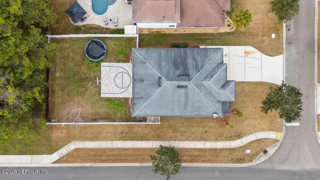 a view of a house with swimming pool and sitting area