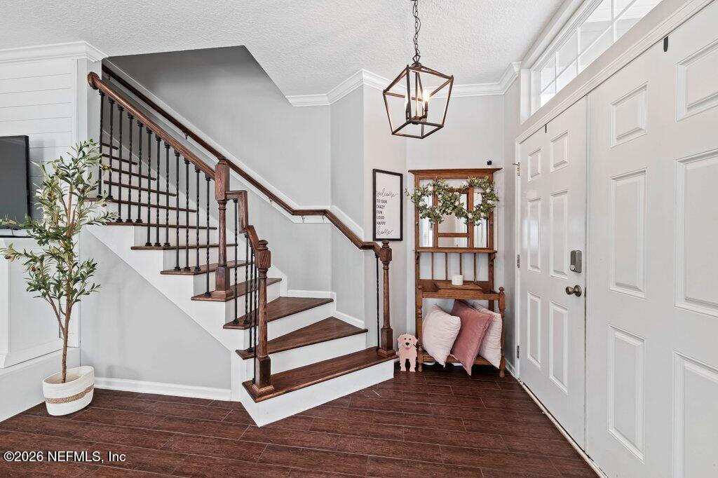81015 Lockhaven Drive Yulee, FL 32097 - Photo 7 of 55 a view of entryway and hall with wooden floor