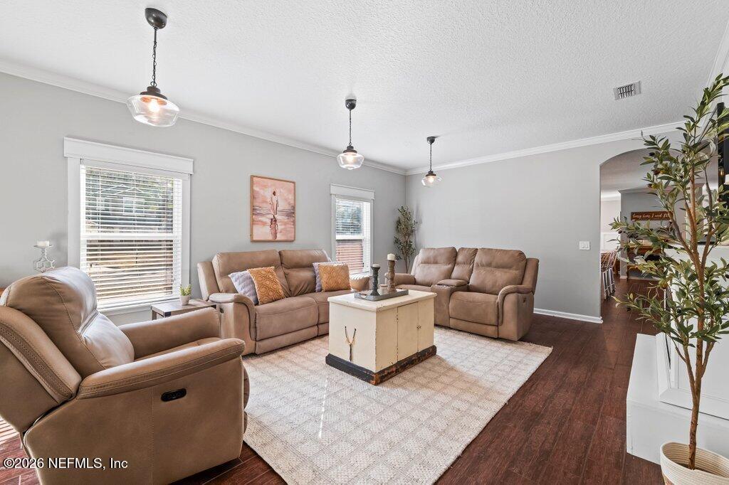81015 Lockhaven Drive Yulee, FL 32097 - Photo 9 of 55 a living room with furniture and a large window