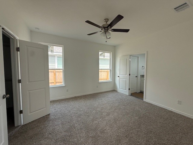 2607 Falcon Ridge Drive Bryan, TX 77803 - Photo 7 of 8 a view of a livingroom with a ceiling fan & windows