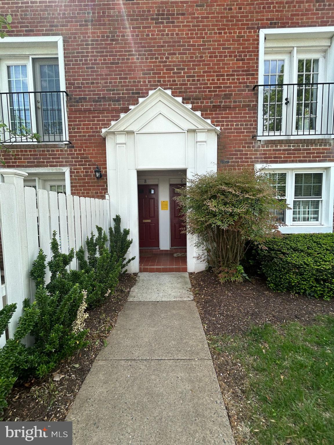 4657 A 28th Road South, Unit A Arlington, VA 22206 - Photo 1 of 12 a front view of a house with garden