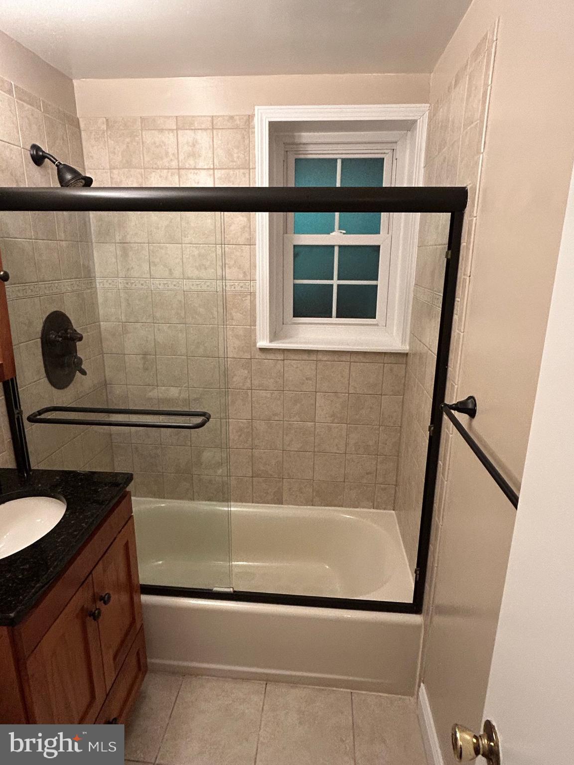 4657 A 28th Road South, Unit A Arlington, VA 22206 - Photo 8 of 12 a bathroom with a shower and a sink