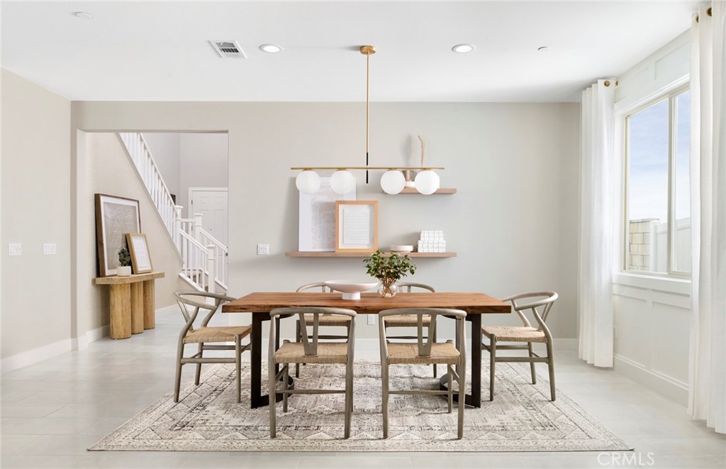 4635 Stratford Place Perris, CA 92571 - Photo 4 of 16 a view of dining room and hall with furniture