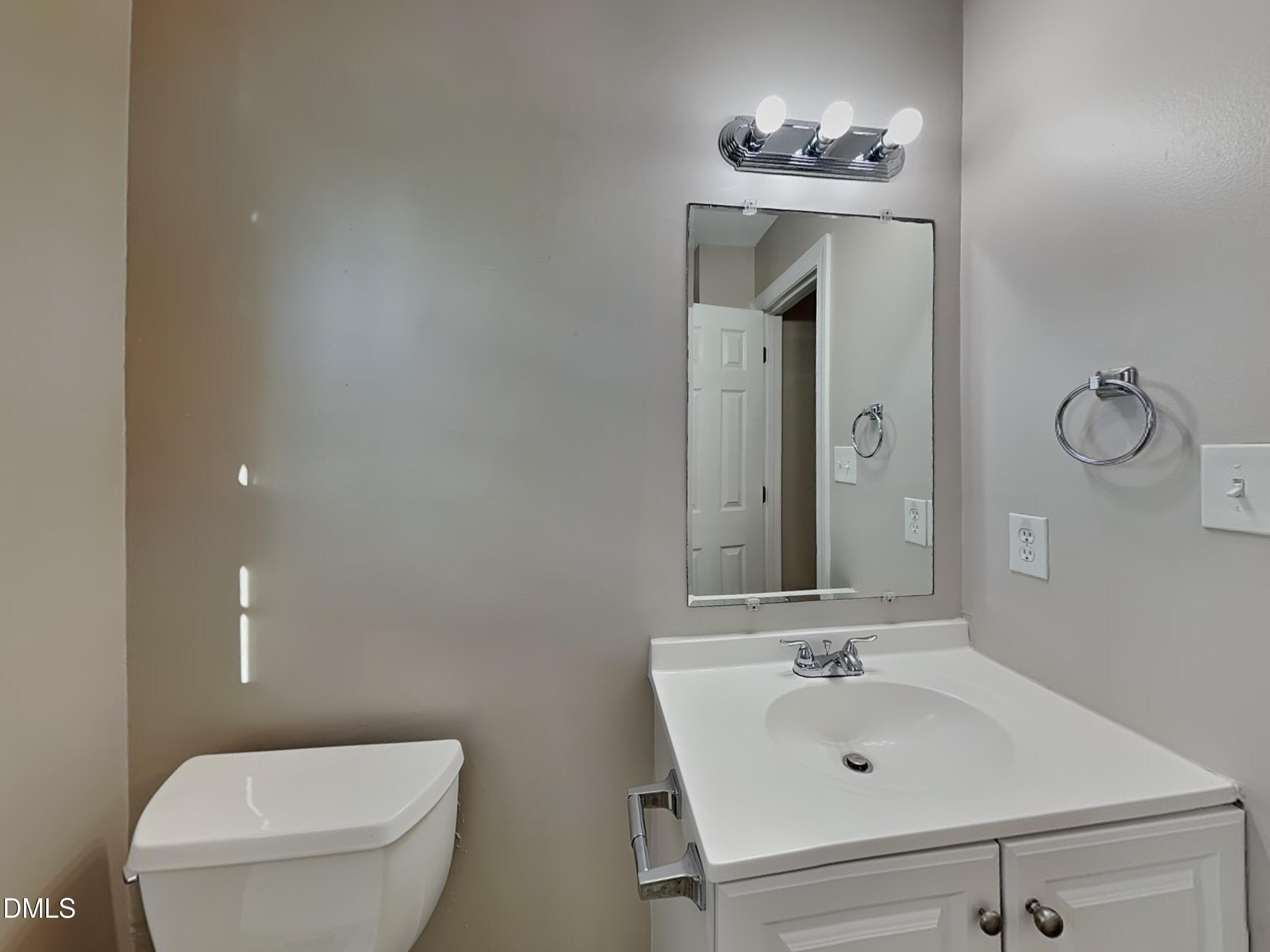 622 Commander Drive Wendell, NC 27591 - Photo 13 of 16 a bathroom with a sink toilet and mirror