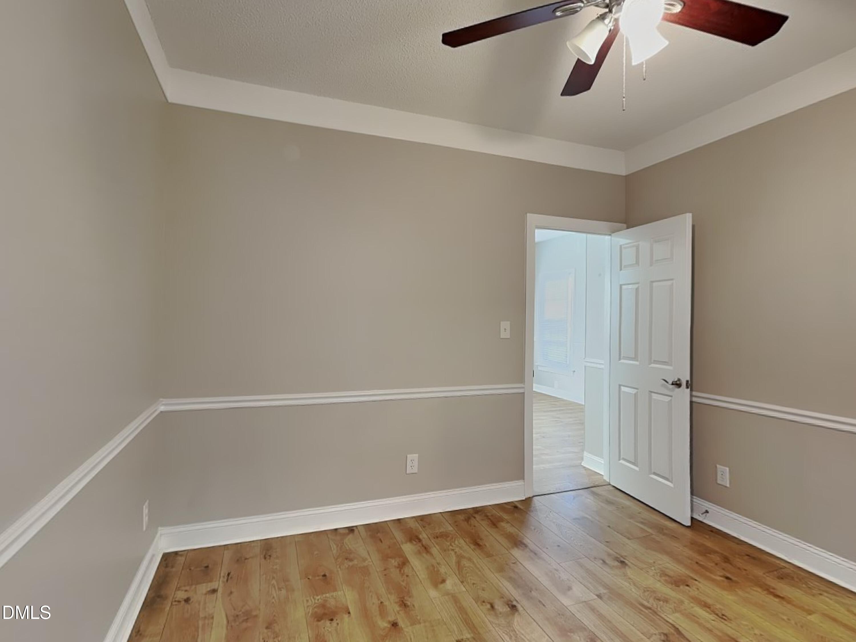 622 Commander Drive Wendell, NC 27591 - Photo 16 of 16 an empty room with wooden floor and windows