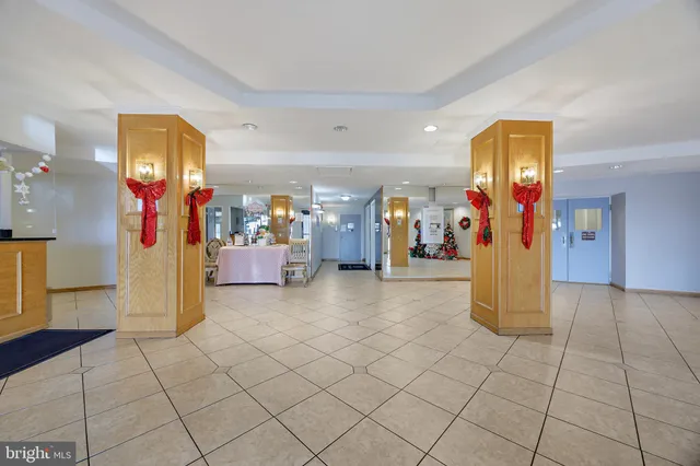 a view of a entryway with furniture and refrigerator