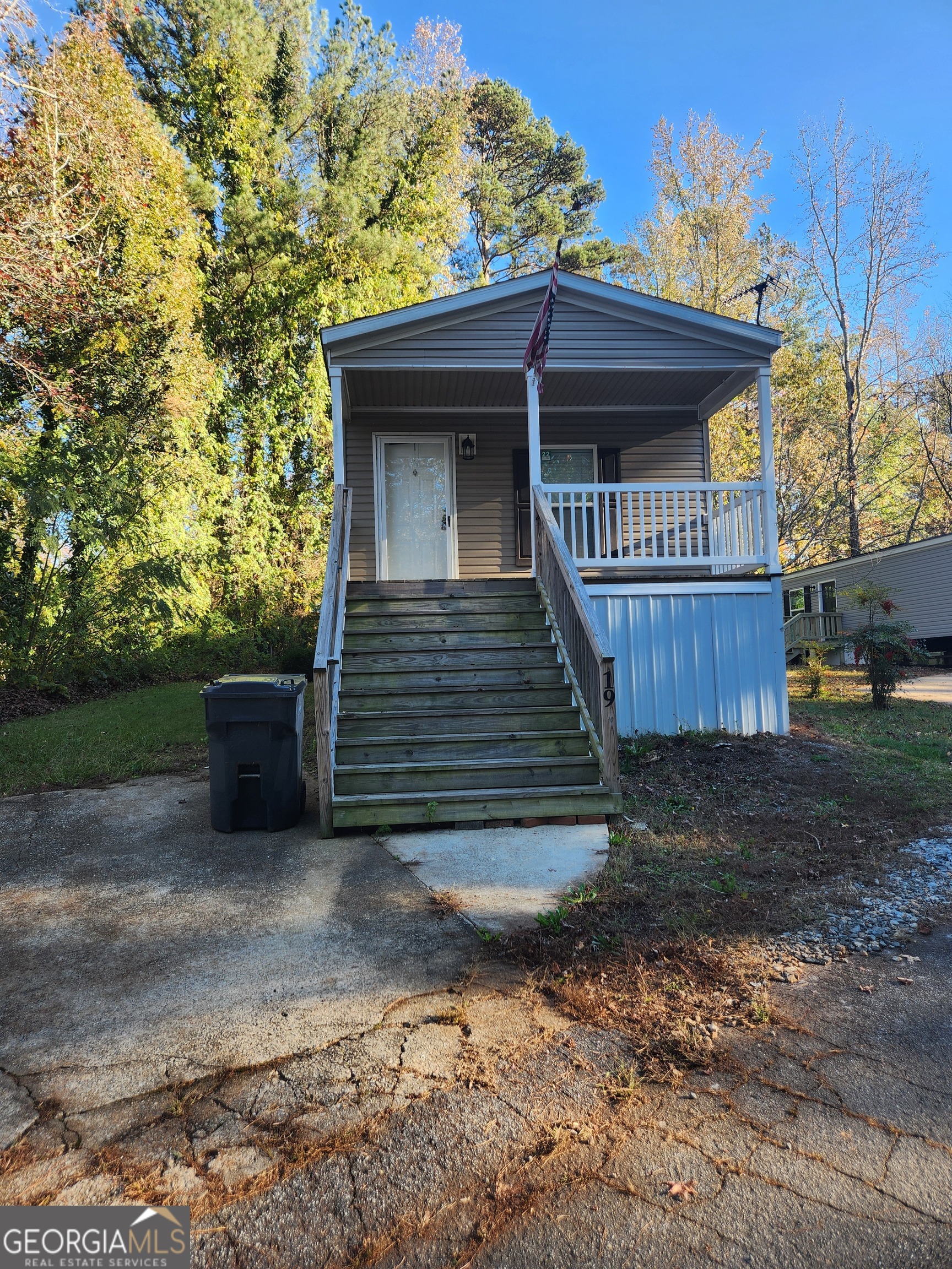 1979 Cardell Road, Unit 19 Austell, GA 30168 - Photo 1 of 1 a view of a house with a yard
