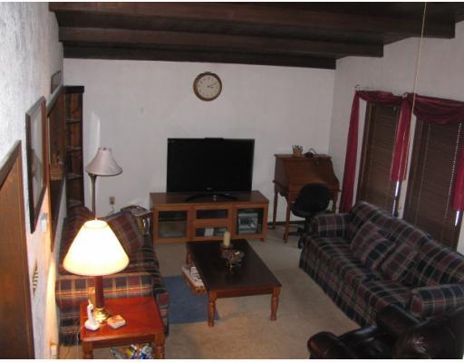 199 Burrell Hill Road Penn, PA 15675 - Photo 8 of 16 Living Room. Living Room has newer carpet, vaulted and beam ceils.