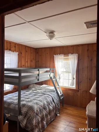 a bed sitting in a room next to a window