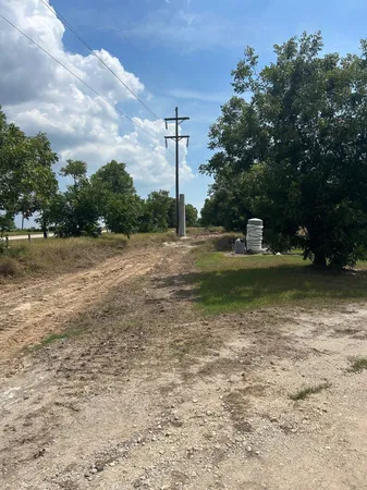a view of a lake with a house in the background