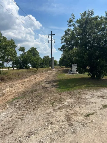 a view of a lake with a house in the background