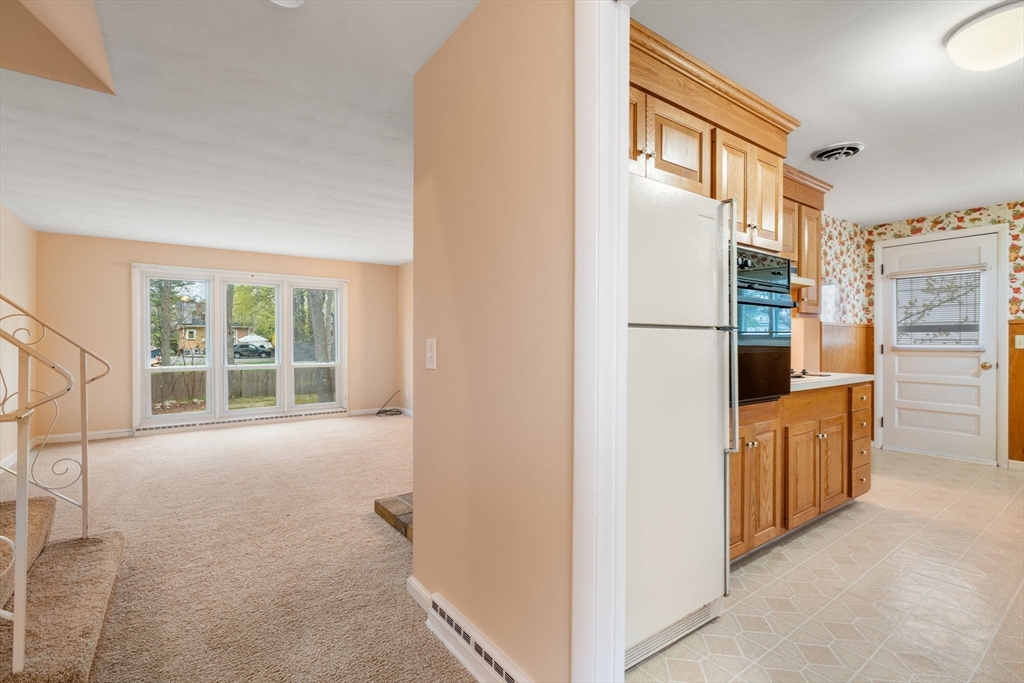 18 Royce Road Framingham, MA 01701 - Photo 6 of 30 a kitchen with stainless steel appliances a refrigerator and a stove