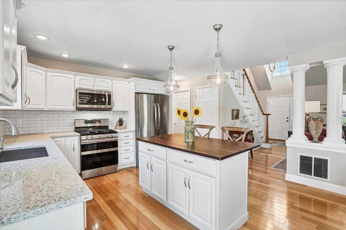 119 Ridge Road Clinton Corners, NY 12514 - Photo 13 of 31 a kitchen with stainless steel appliances granite countertop a stove a sink and a refrigerator