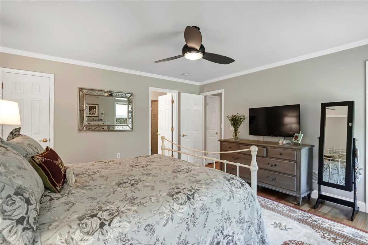 119 Ridge Road Clinton Corners, NY 12514 - Photo 17 of 31 a bedroom with a bed and a flat screen tv