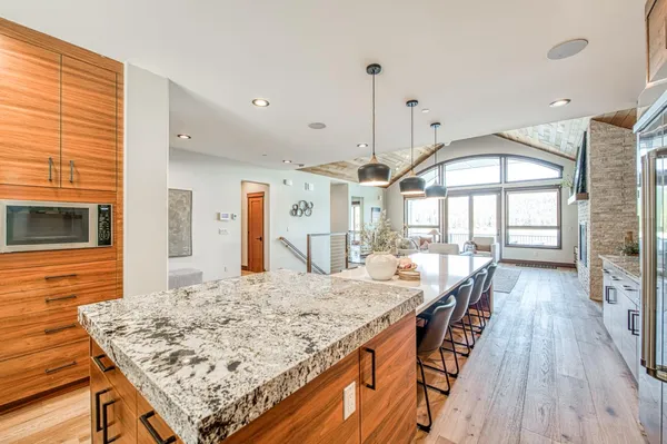 a spacious bedroom with a large bed and a large window