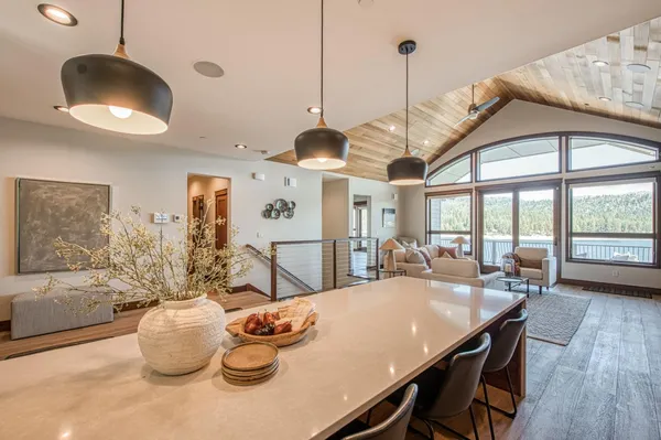 a spacious bedroom with a balcony a bed and a fireplace