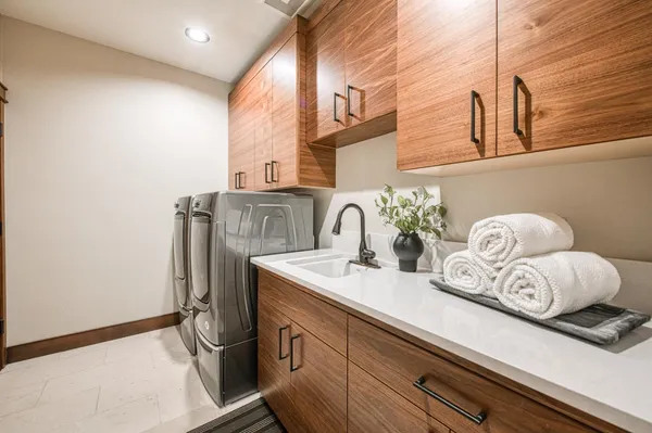 a bathroom with a granite countertop tub sink shower and mirror