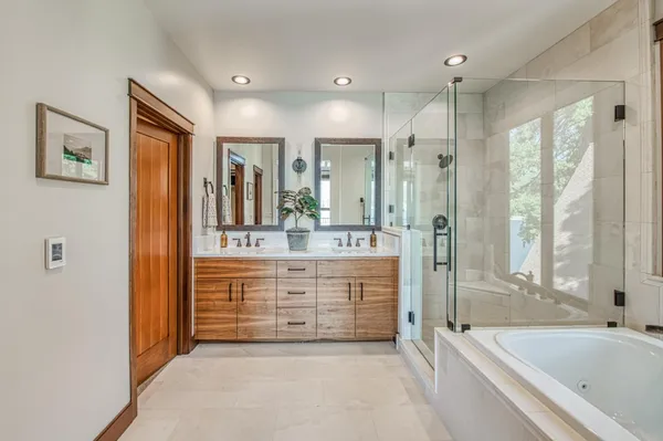a living room with furniture and potted plant