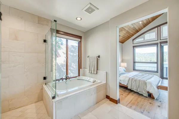 a bathroom with a double vanity sink mirror and double