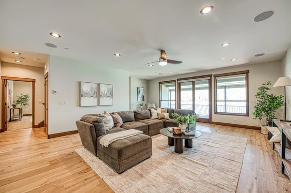 a spacious bedroom with a bed and a large window