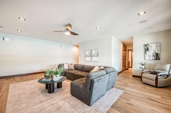 a bedroom with a bed and a couch with window