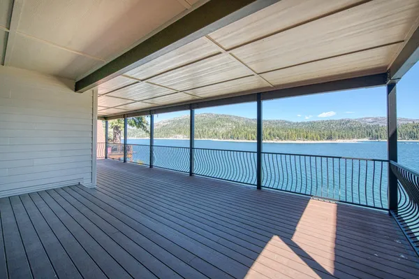 a view of balcony with wooden floor
