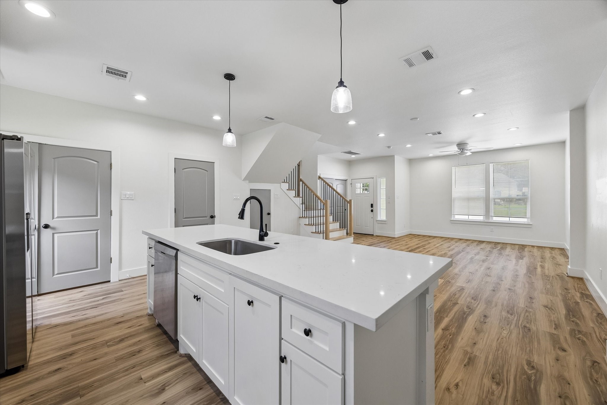 2749 Redrock Street, Unit B Houston, TX 77088 - Photo 9 of 24 Off the kitchen is the half bathroom and the laundry area for ease.