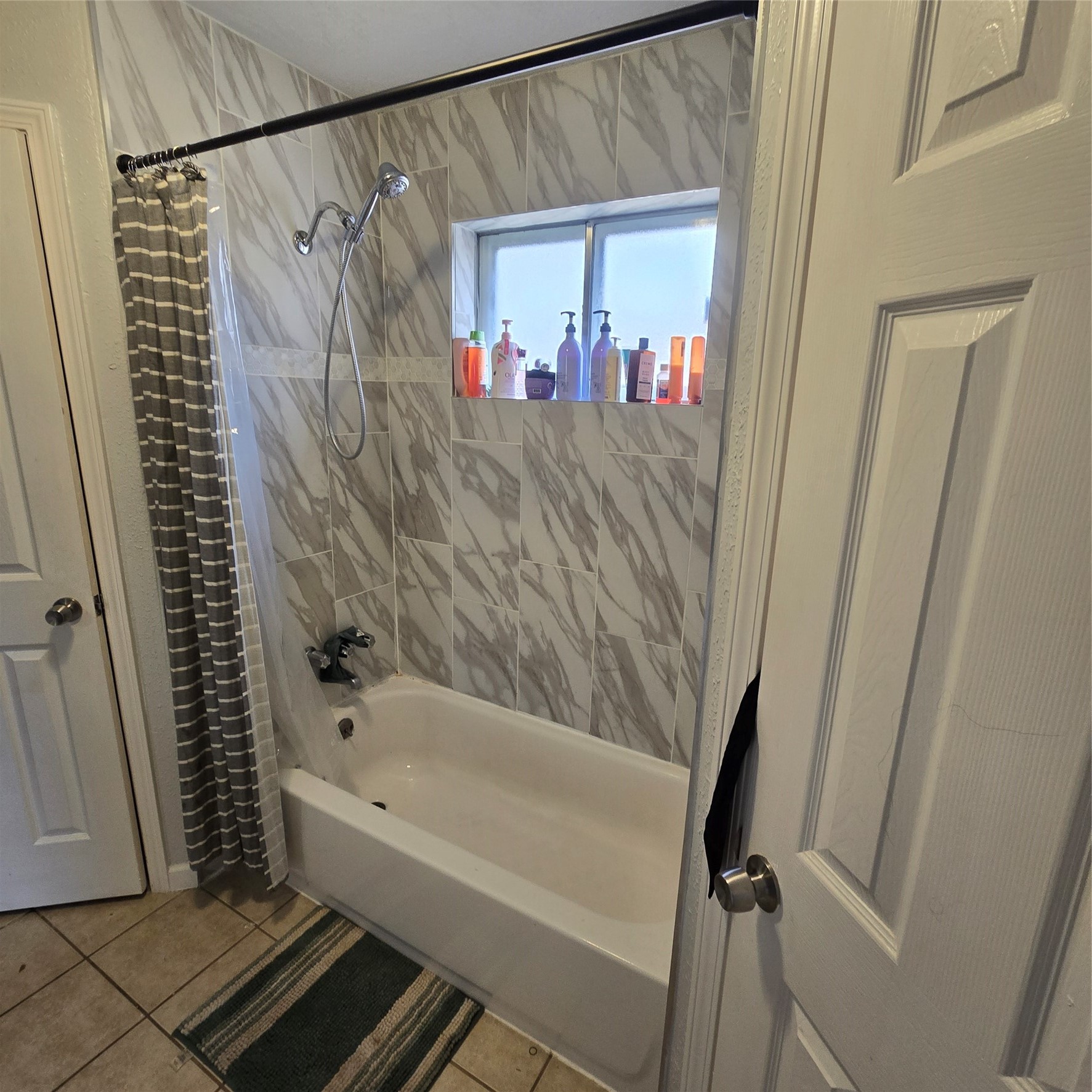 22527 Millgate Drive Spring, TX 77373 - Photo 16 of 30 a bathroom with a bathtub and a shower