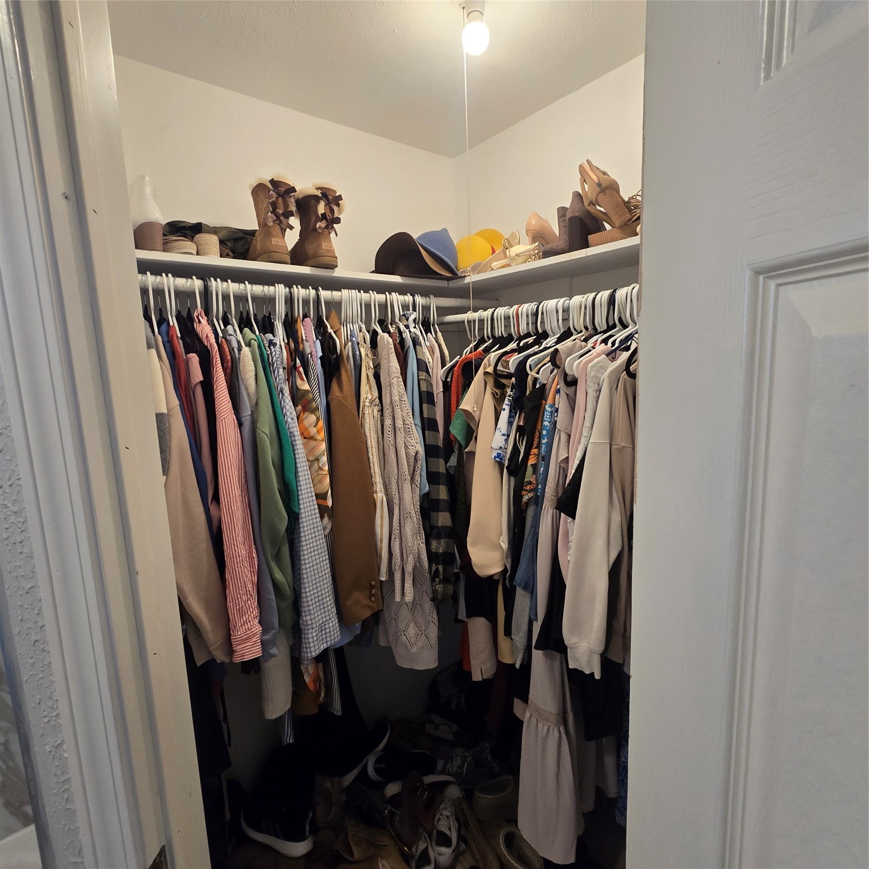 22527 Millgate Drive Spring, TX 77373 - Photo 17 of 30 a view of walk in closet with clothes and shoes