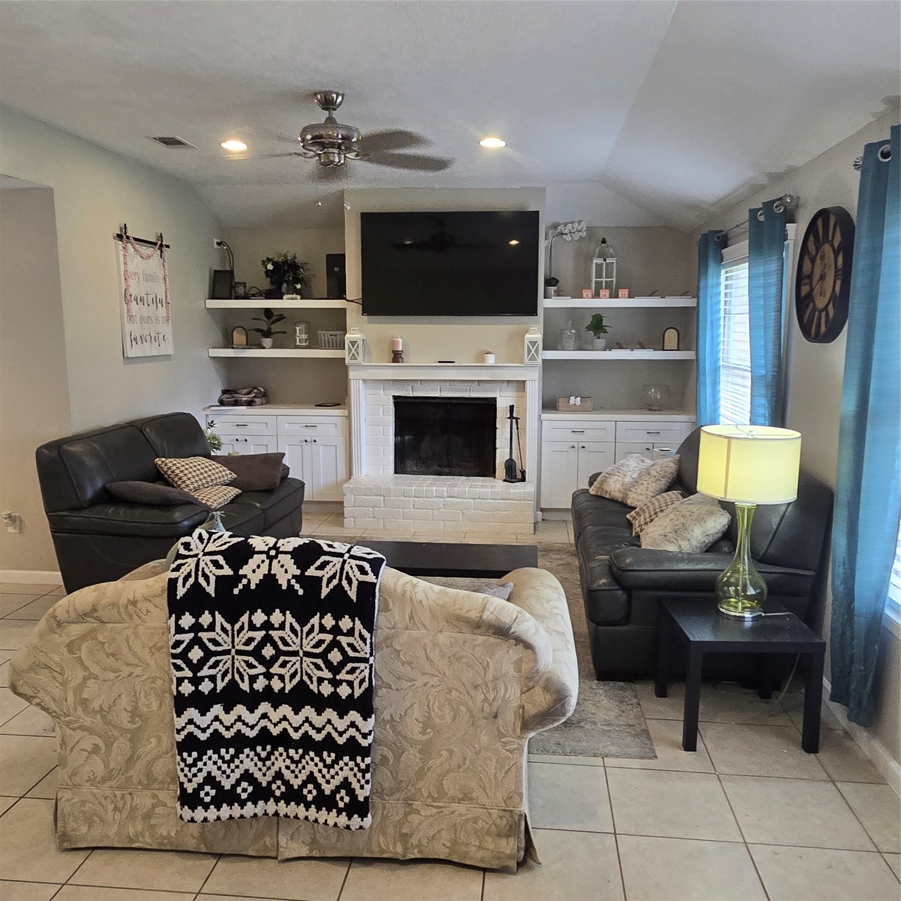 22527 Millgate Drive Spring, TX 77373 - Photo 5 of 30 a living room with furniture a flat screen tv and a fireplace