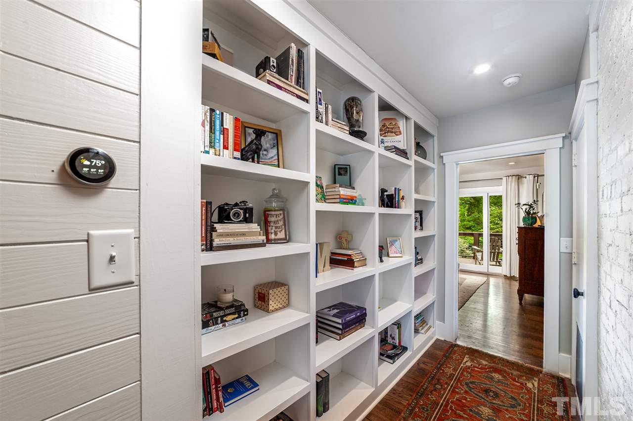 2251 Cranford Road Durham, NC 27705 - Photo 14 of 30 Immediately off the entry hallway and leading to the main level Master Bathroom Ensuite is a wall of custom built-in bookshelves.