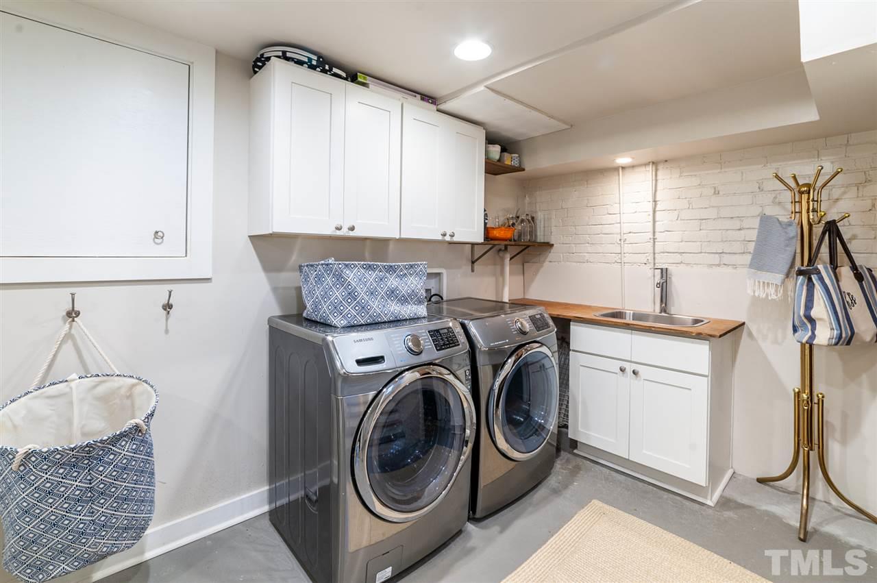 2251 Cranford Road Durham, NC 27705 - Photo 25 of 30 In the Laundry Room you'll find a Samsung stainless steel front load washer and dryer, built-in cabinets plus sink with countertop. The Laundry Room is located in the finished basement.
