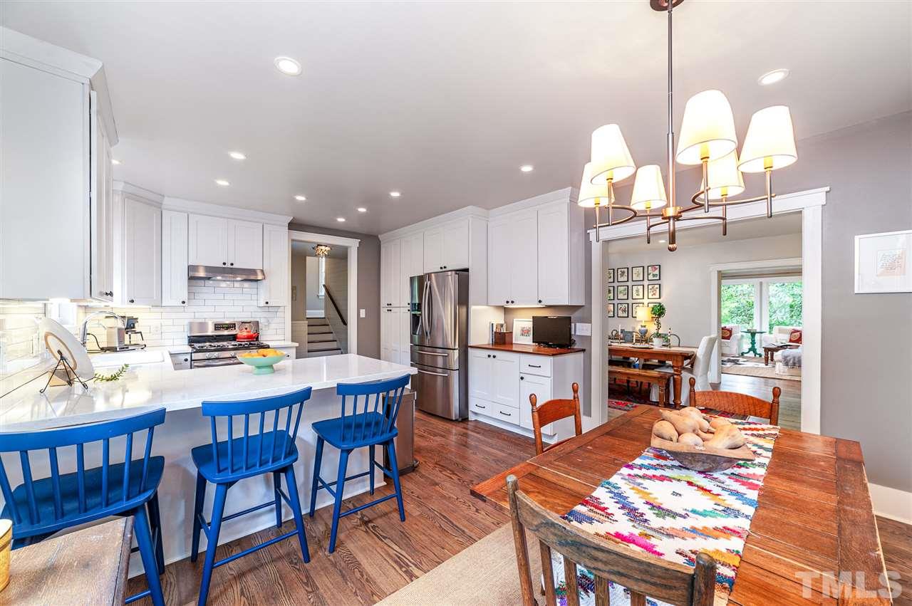 2251 Cranford Road Durham, NC 27705 - Photo 8 of 30 The open-concept kitchen with peninsula provides additional countertop seating or counter space for baking and cooking.