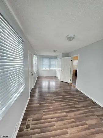 a view of outdoor space with wooden floor and window