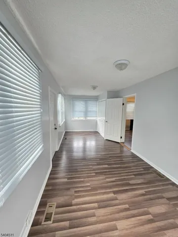 a view of outdoor space with wooden floor and window