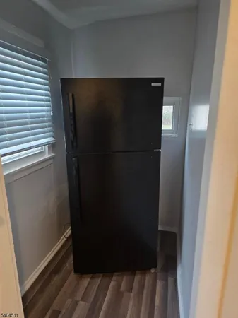 a refrigerator freezer sitting inside of a kitchen