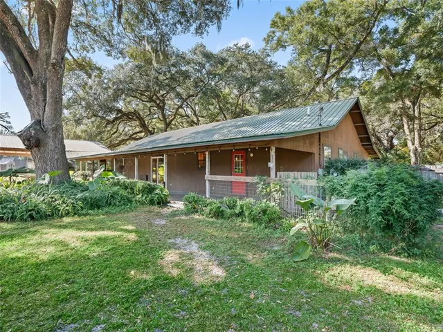 a front view of a house with a yard and porch