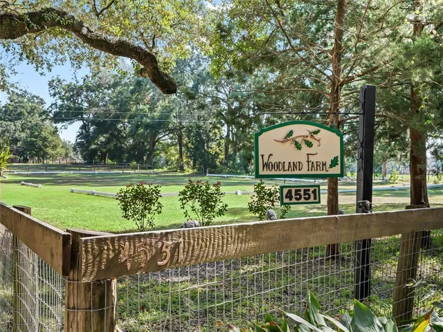 a view of a wooden fence with a sign board