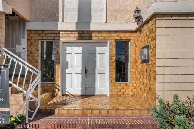 a view of a brick house with an outdoor space