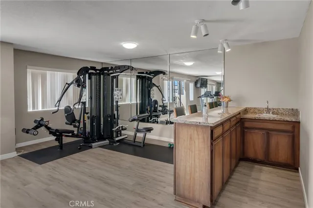 a view of a kitchen with sink cabinets and wooden floor