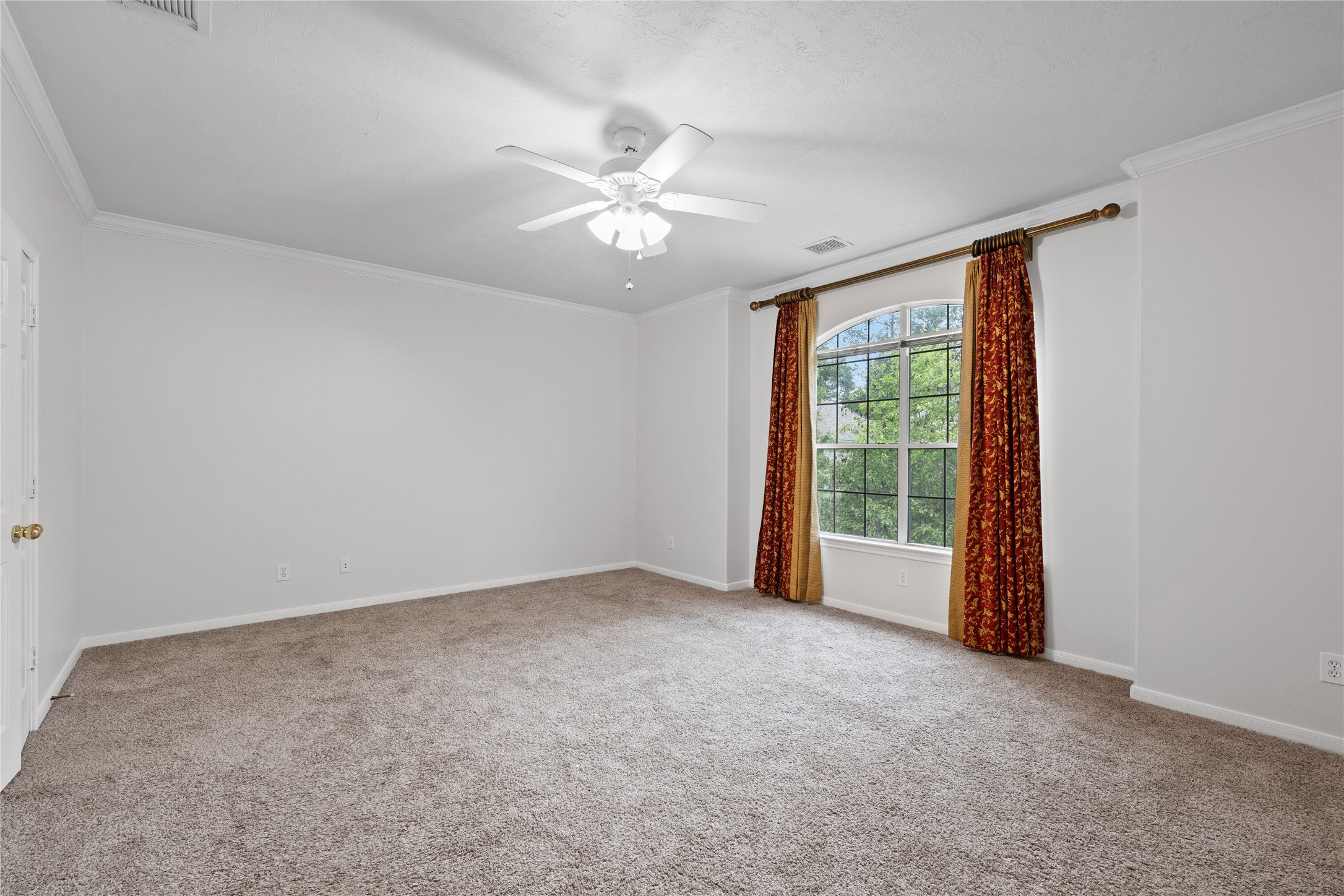 107 West Burberry Circle The Woodlands, TX 77384 - Photo 13 of 28 a view of an empty room with a window