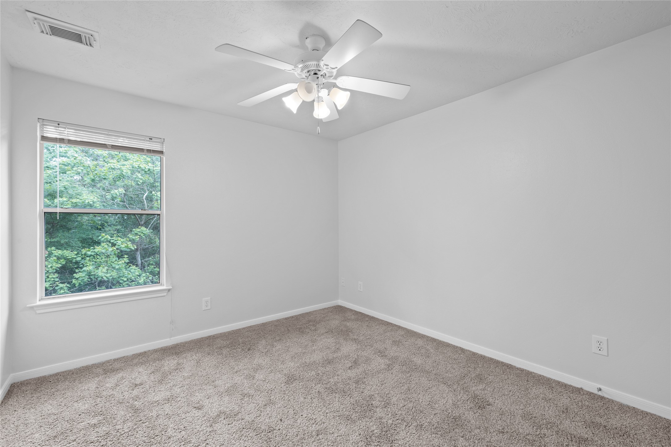 107 West Burberry Circle The Woodlands, TX 77384 - Photo 20 of 28 an empty room with a window