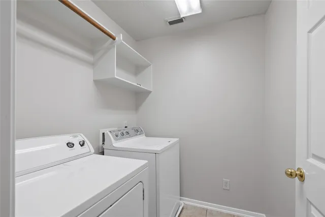 a backyard of a house with green floor and outdoor space