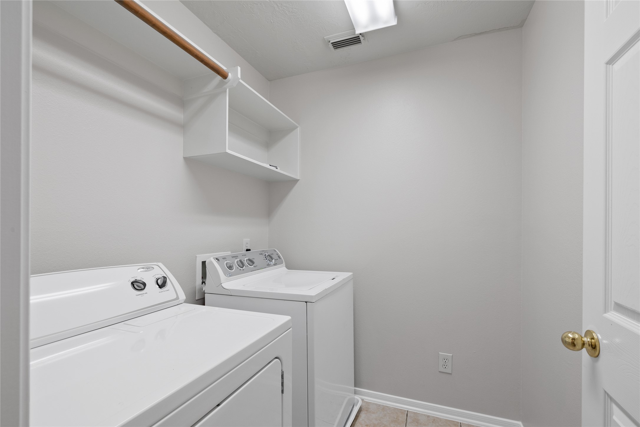 107 West Burberry Circle The Woodlands, TX 77384 - Photo 23 of 28 a utility room with dryer and washer