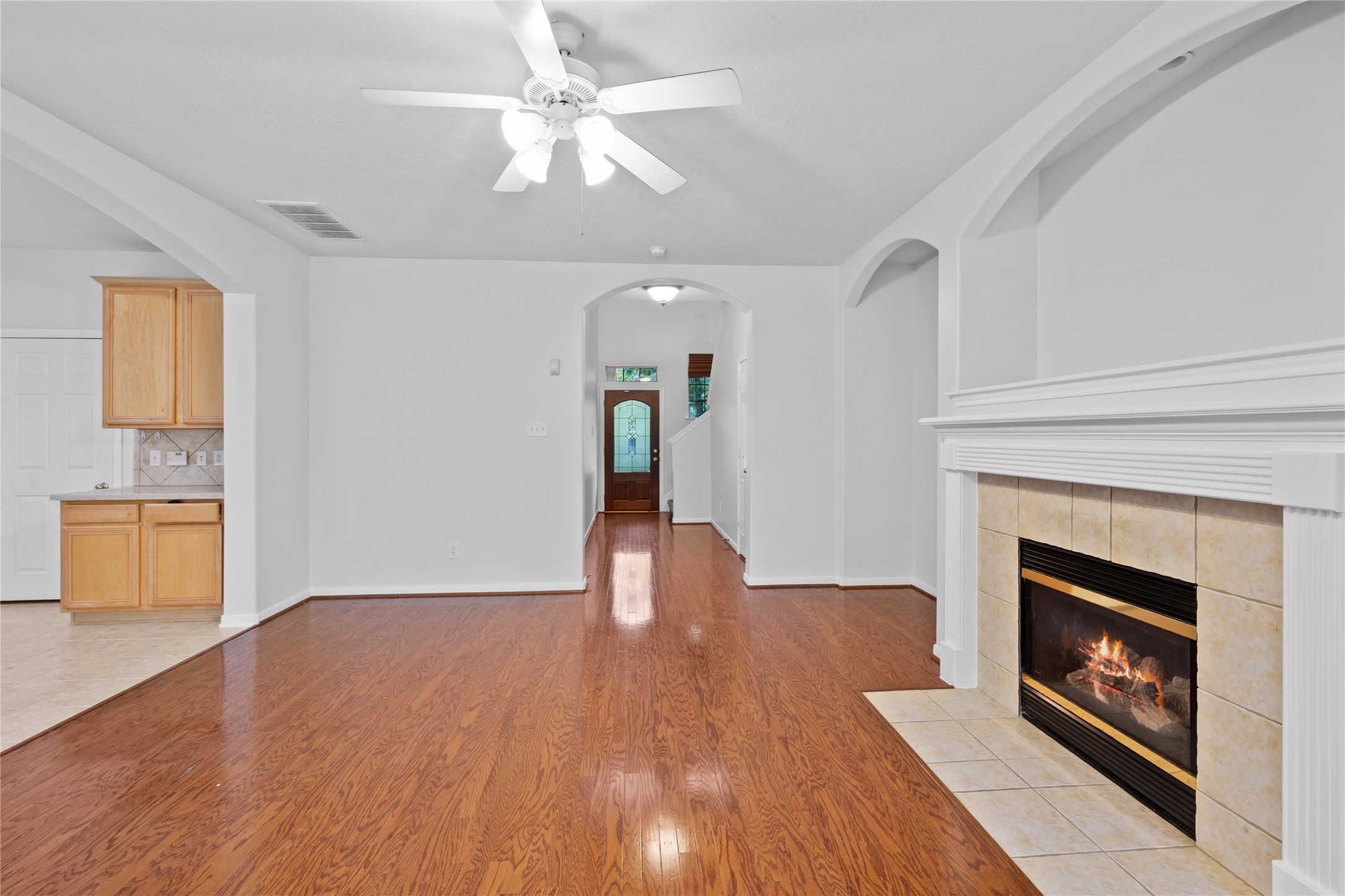 107 West Burberry Circle The Woodlands, TX 77384 - Photo 4 of 28 a view of an empty room with a fireplace and a window