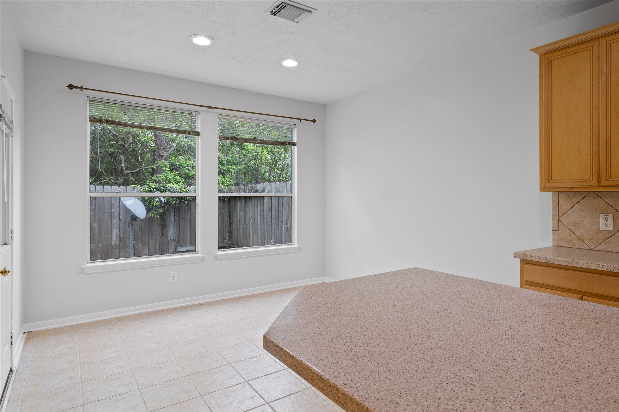 107 West Burberry Circle The Woodlands, TX 77384 - Photo 8 of 28 a view of an empty room with a window
