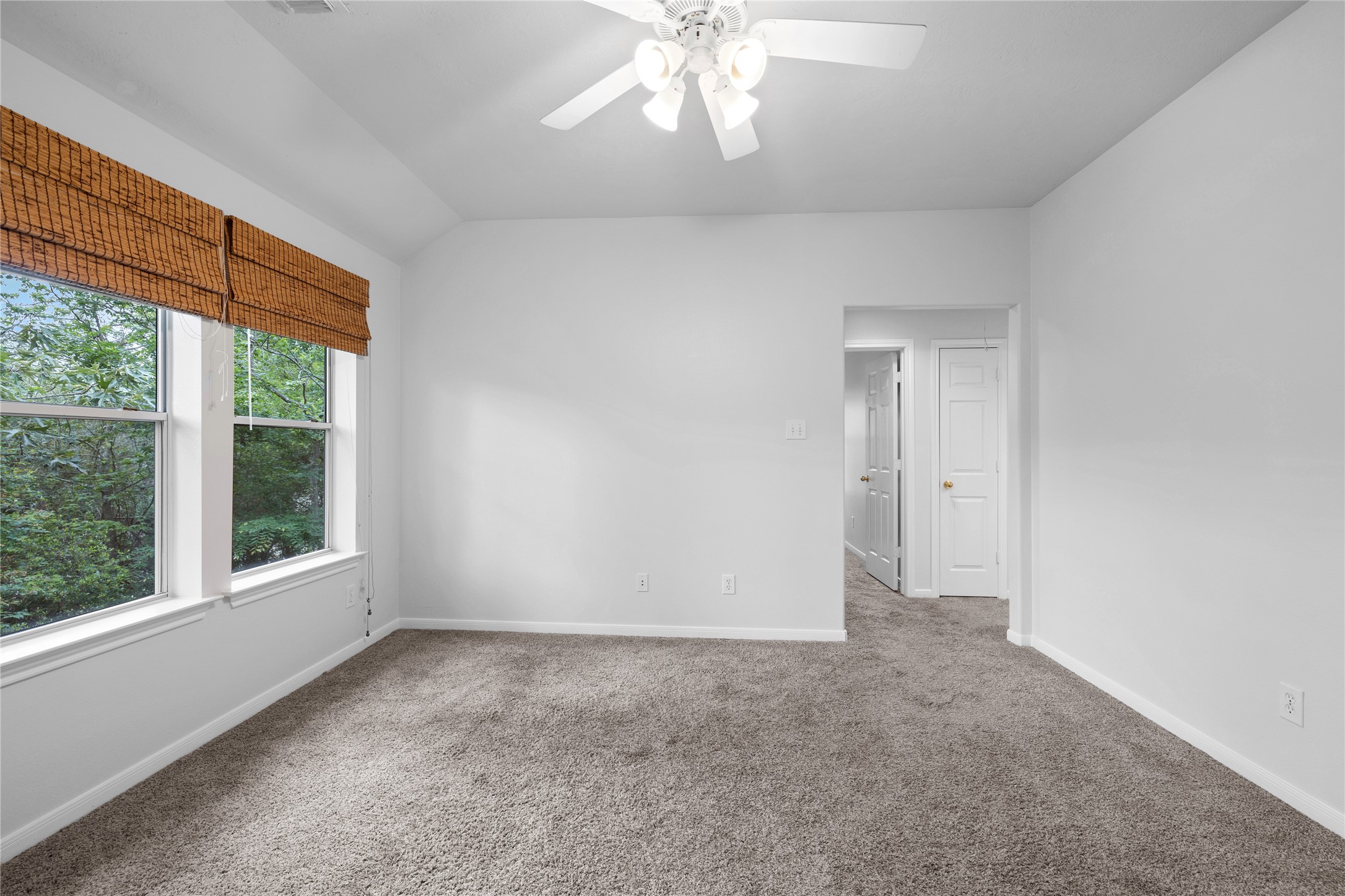 107 West Burberry Circle The Woodlands, TX 77384 - Photo 10 of 28 a view of an empty room with a window